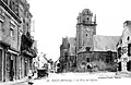 Baud : l'ancienne église Saint-Pierre et la place de l'Église au début du XXe siècle (carte postale).