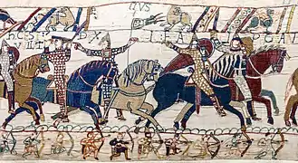 Détail d'une tapisserie montrant des hommes à cheval