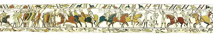 Détail d'une tapisserie montrant à gauche des hommes à pied en armes et à droite des cavaliers brandissant des lances
