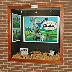 Blutch illustrant le thème du saut à cheval dans les couloirs du Centre sportif de Blocry à Louvain-la-Neuve.