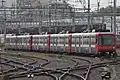 Les cinq rames radiées en attente de revente, le 30 juillet 2014, à la gare de Genève.