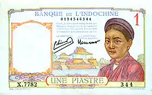 Un billet de banque portant la mention « une piastre », orné d'un dessin représentant une femme asiatique en habit traditionnel.