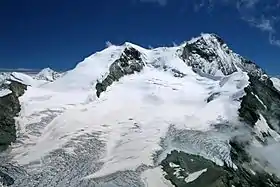 Vue de la tête de Milon, à l'extrême droite, au premier plan, devant le Weisshorn et le Bishorn, au centre.