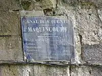 Plaque à la sortie du tunnel de Riqueval.