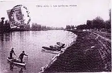 Carte postale représentant le canal de Miribel à Thil dans les années 1900.