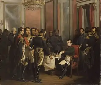 Tableau montrant l'empereur assis à un bureau, tendant l'acte qu'il vient de signé à un maréchal se tenant debout, les autres maréchaux l'entourant.
