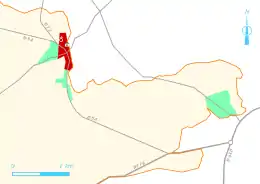 Vue d'une carte en couleur représentant les principales routes d'une commune et l'extension de son urbanisation ; légende détaillée ci-dessous.