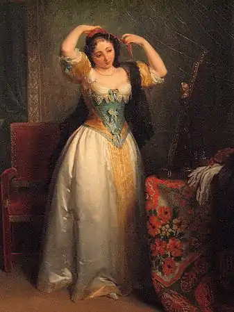 Jeune femme devant son miroir.