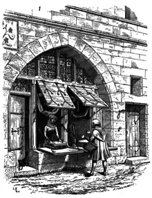 Boutique médiévale avec les volets et une claire-voie vitrée (dessin de Viollet-le-Duc).