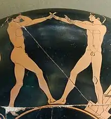 Scène de boxe. Adversaires en garde. Coupe (kylix) attique à figures rouges, v. 470. Louvre.