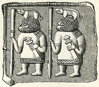 une gravure représentant deux guerriers stylisés avec lance, épée et casque au sanglier