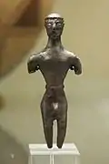 Figurine masculine en bronze. Crète, VIIIe siècle av. J.-C. British Museum.