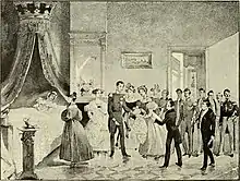 gravure en noir et blanc représentant la reine alitée dans un lit avec ciel dans la même chambre que le roi en uniforme qui se penche vers un nouveau-né présenté par une dame de la cour.