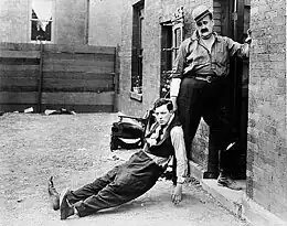 Description de l'image Buster Keaton (left) and Joe Roberts in the movie Neighbors (1920).jpg.