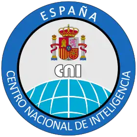 un logo de couleur bleu avec les emblèmes de l'Espagne au centre