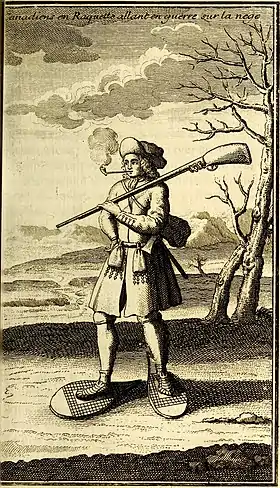 Un milicien canadien en tenue de guerre hivernale à l’époque des affrontements coloniaux en Amérique du Nord.(Gravure française de 1722)