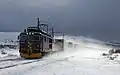 Une locomotive El 14 roulant sur la Dovrebanen en plein hiver.