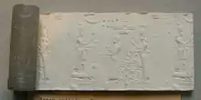 Sceau-cylindre en calcédoine représentant scène de culte à Adad et à Ishtar. Cabinet des médailles.