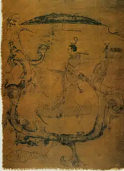 Gentilhomme chevauchant un dragon qui porte aussi une grue de bon augure. Un poisson les accompagne. Encre sur soie. IIIe siècle, 37,5 × 28 cm. Changsha Musée provincial, Hunan.