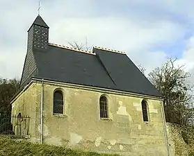 Photographie en couleurs de la nef d'un édifice religieux vue en contrebas.