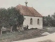 Photographie coloriée représentant un édifice religieux.