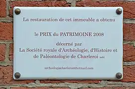 Exemple de la plaque du prix, ici celui de 2008 pour la restauration de l'immeuble « Le Mayence ».