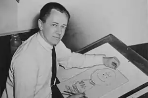 Charles M. Schulz dessinant Charlie Brown