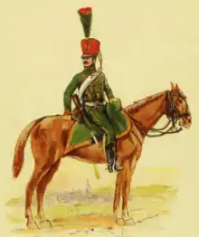 Cavalier vêtu de vert, de profil, sur son cheval.