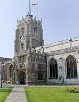 Apparition de la brique en partie supérieure du porche de la cathédrale de Chelmsford (vers 1500).