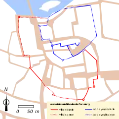 Carte en couleurs représentant le tracé d'enceintes sur le plan d'une ville.