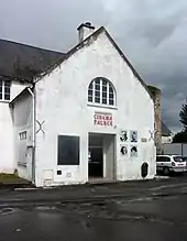 Photographie d'un bâtiment portant l'inscription « Cinéma Palace » sur sa façade.