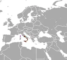 Planisphère de couleur grise représentant en brun la présence du Lièvre corse dans le monde (Corse et une partie de l'Italie).