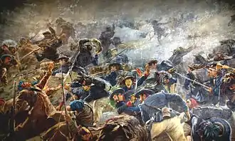 Fresque représentant une bataille au corps à corps entre des soldats en vestes bleues et pantalons blancs face à des soldats portant un manteau brun