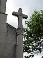 Croix ouvragée située devant l'église, don de J. Auclair, maire de Saint-Maurice-les-Châteauneuf, elle est l'œuvre du tailleur de pierres Burthier ;  bénie le 9 mai 1888 par Mgr Perraud, évêque d'Autun.