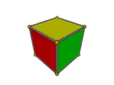 Trois losanges déformés inscrits dans un hexagone (rouge, jaune et vert).