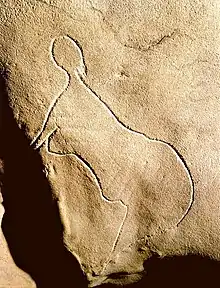 Grotte de Cussac,gravure d'une silhouette de femme.