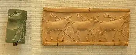 Sceau-cylindre en calcaire et son impression : troupeau de bœufs dans un champ de blé. Musée du Louvre.