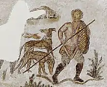 Détail d'une mosaïque avec deux personnages dont l'un est détruit et des chiens