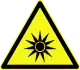 Avertissement sur les rayons lumineux, symbole D-W009 introduit par la norme allemande DIN 4844-2