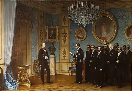 une délégation de dix hommes en costume noir s'adresse à Maximilien revêtu d'un uniforme