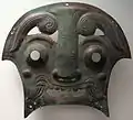 Plaque de char de guerre en forme de masque. Zhou occidentaux. Musée Guimet Paris