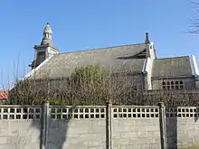 Église Saint-Stanislas de la cité Bruno de Dourges, ainsi que les façades et les toitures de son presbytère.