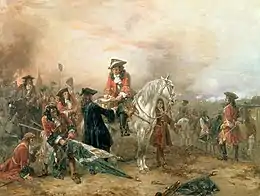 Fin de bataille victorieuse, officier sur un cheval blanc, drapeaux ennemis collectés.