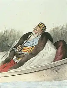 portrait d'un homme à la barbe blanche fumant dans une barque