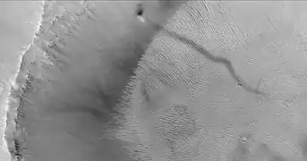 Tourbillon de poussière sur Mars, photographié par Mars Global Surveyor.