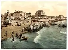 ancienne carte postale colorisée représentant une plage anglaise du Sussex vers 1900