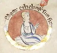 Enluminure circulaire représentant un jeune homme vêtu d'une robe bleue