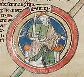 Une miniature représentant le roi assis et couronné, une main pointée vers le bas et l'autre tenant une épée