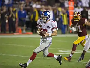 Eli Manning, quarterback des Giants de New York, balle en main en 2014.