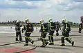 Plusieurs pompiers de Zaventem en tenue de feu lors d'un exercice catastrophe à l'aéroport de Bruxelles, en 2013.